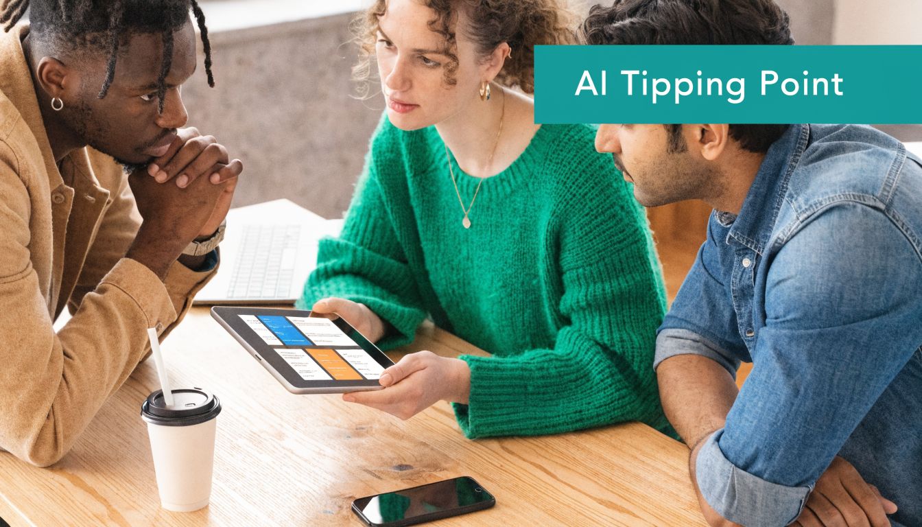 Three professional colleagues collaborating around a tablet to discuss digital strategy in an office workspace.